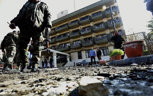 Syrian security forces inspect the site of a suicide attack at a police officer's club in the Masaken Barzeh district of the capital Damascus on February 9, 2016.    
The Syrian Observatory for Human Rights said about 20 people had also been wounded, adding that policemen were among the dead and injured.

 / AFP / LOUAI BESHARA        (Photo credit should read LOUAI BESHARA/AFP/Getty Images)